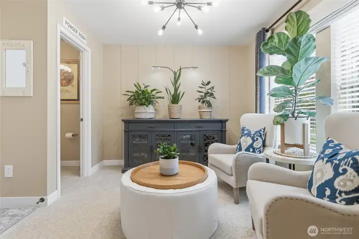 Entry/sitting room/office/guest area  with view to half bath