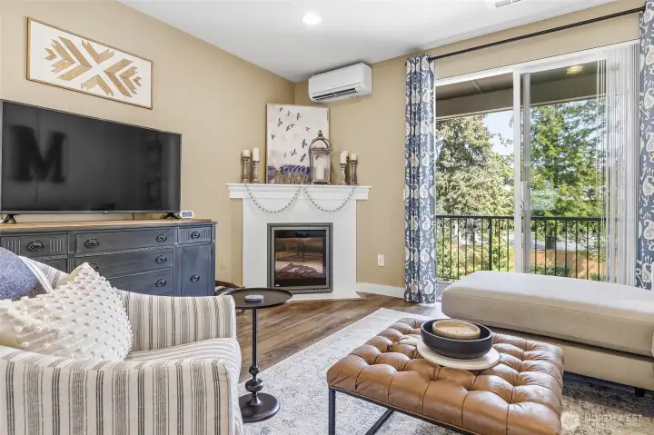 Living room features electric fireplace