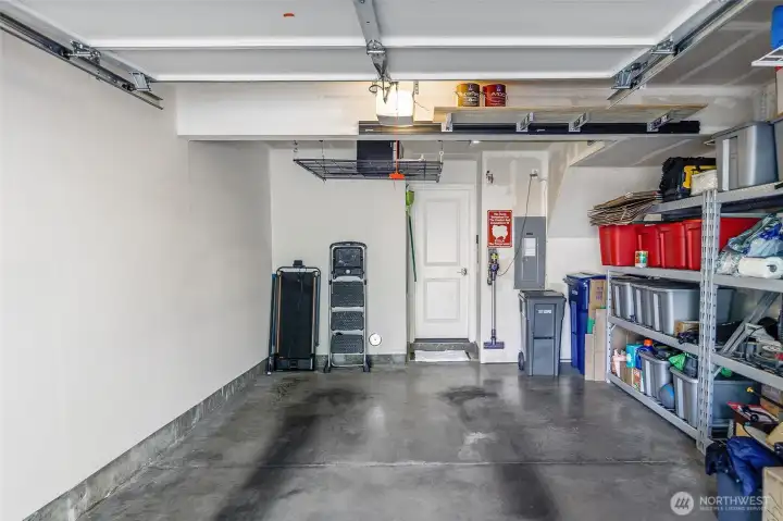 Garage with extra storage, shelving can stay