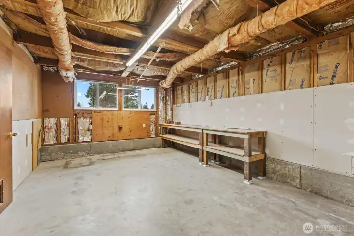 Garage with two 220 Power and additional storage are