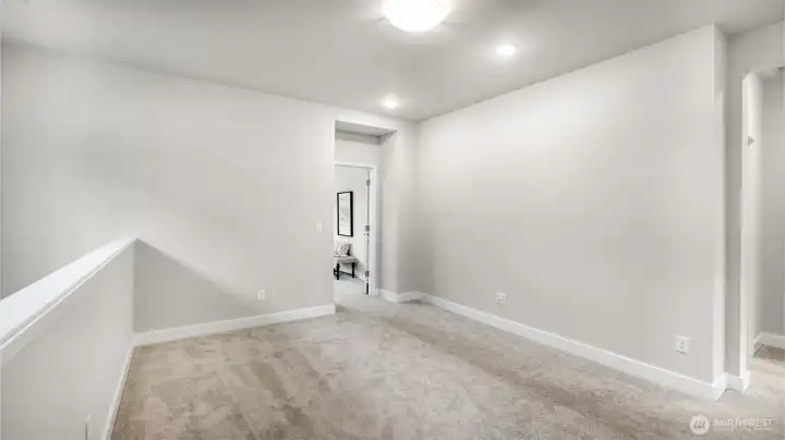 Bonus room/loft has endless possibilities -door straight ahead leads to primary bedroom