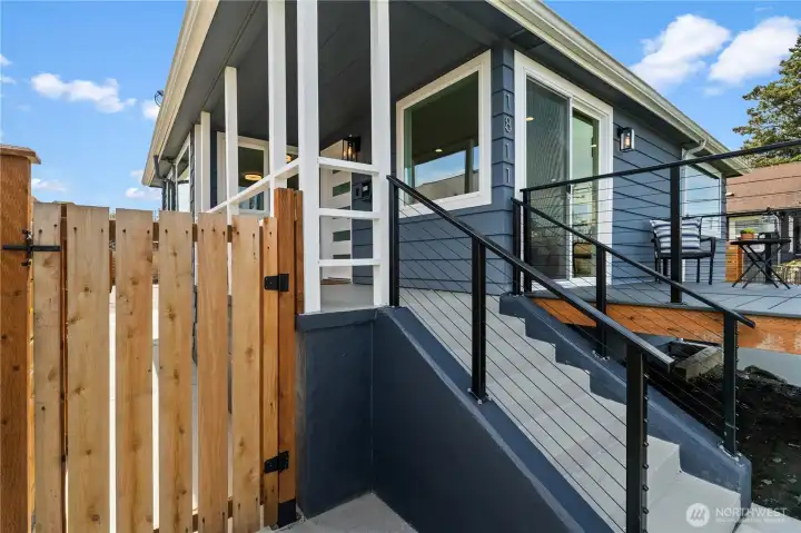 Brand new concrete stairs and metal railings leading up to the home. Freshly painted steps and new concrete landing