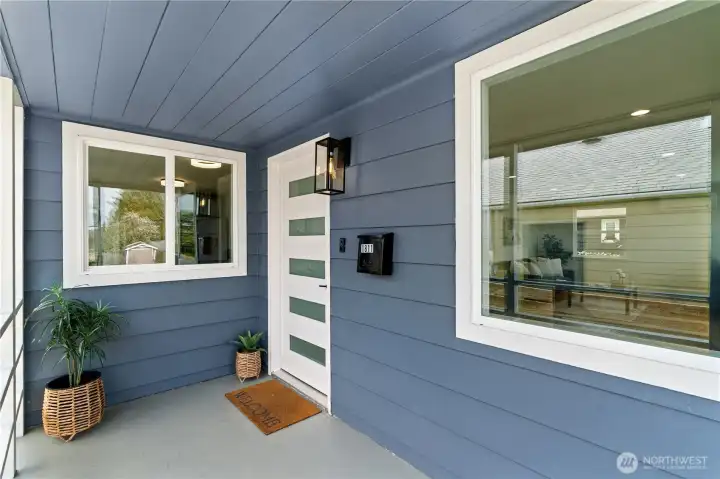 New front door, new lighting fixtures, a mailbox and a ring doorbell camera.