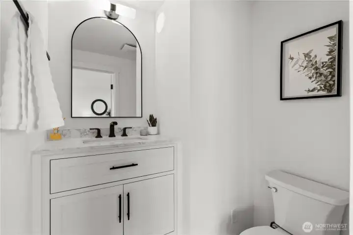Custom 1/2 bath perfect for quick access and guests