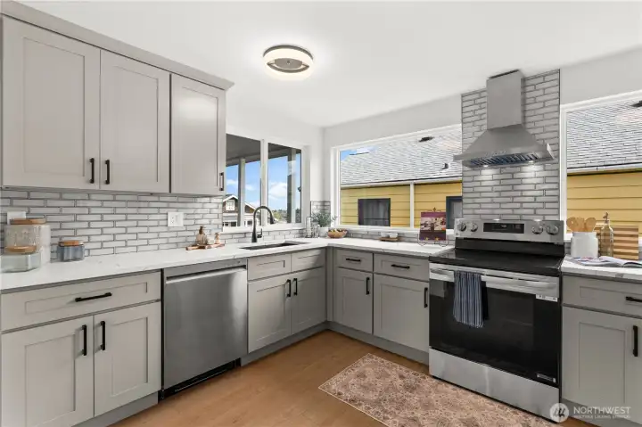 Lots of windows allow much needed light. Window over the sink allows for partial views along with viewing who is coming to visit