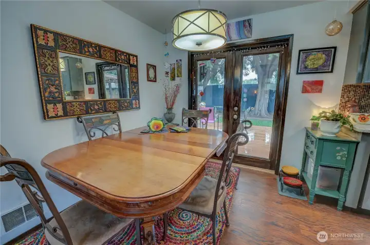 Dining room space off kitchen with french doors leading out to backyard