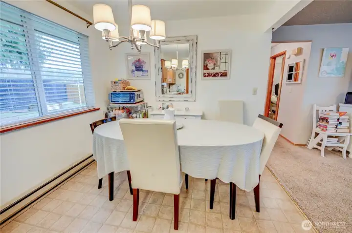 Unit 2021 Dining area off kitchen, next to living room and hallway to bedrooms bathroom