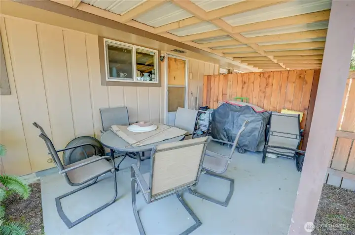 The covered patio in backyard of unit 2021 with access from utility room.