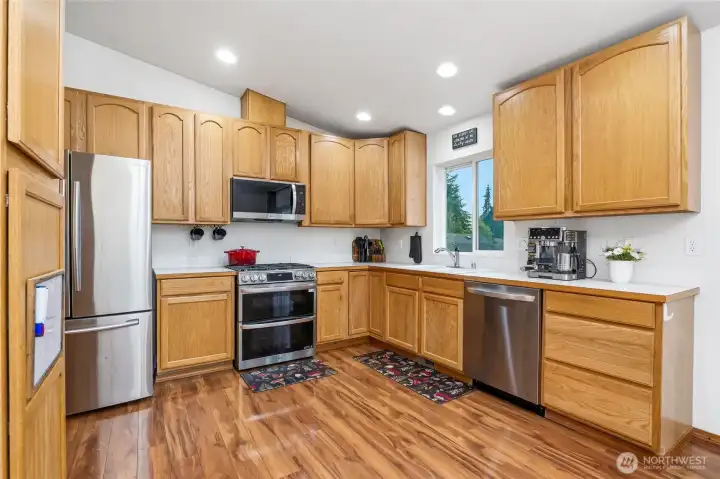 Easy flow kitchen with practically new stainless appliances.