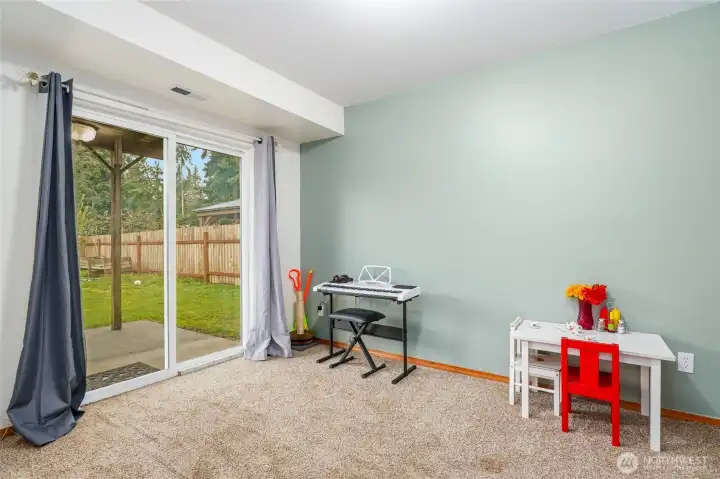 Bedroom #2 on the lower level ... doubles as a possible playroom or office. Slider opens to the backyard and endless possibilities.