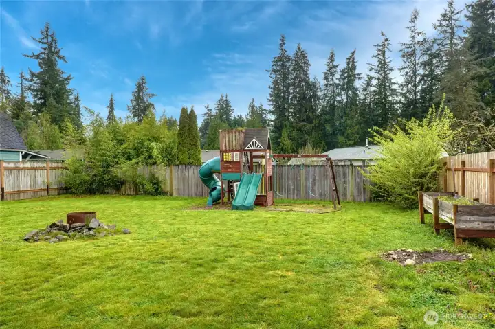 Step out of the house and into your spacious open backyard.  Garden space, fire pit and play yard ready to go!