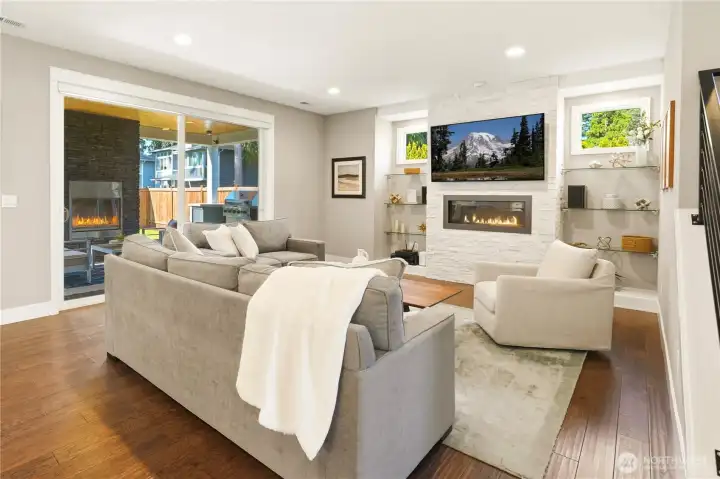 Step outside to a covered, heated patio with a gas fireplace and built-in BBQ.
