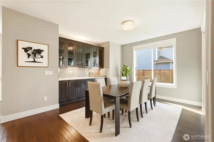 The spacious dining room seats eight with ease. Note the built-in china/storage cabinet.