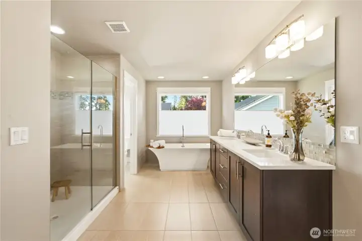 A spa-inspired primary bath with a soaking tub and walk-in shower.