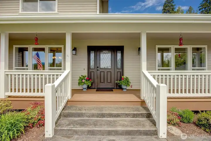 Lovely covered porch and farmhouse railing.