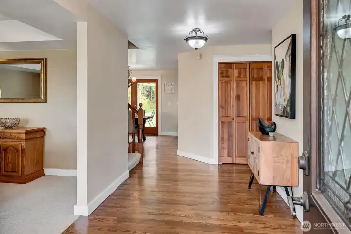 Gorgeous oak hardwood floors flow to the kitchen in the back.