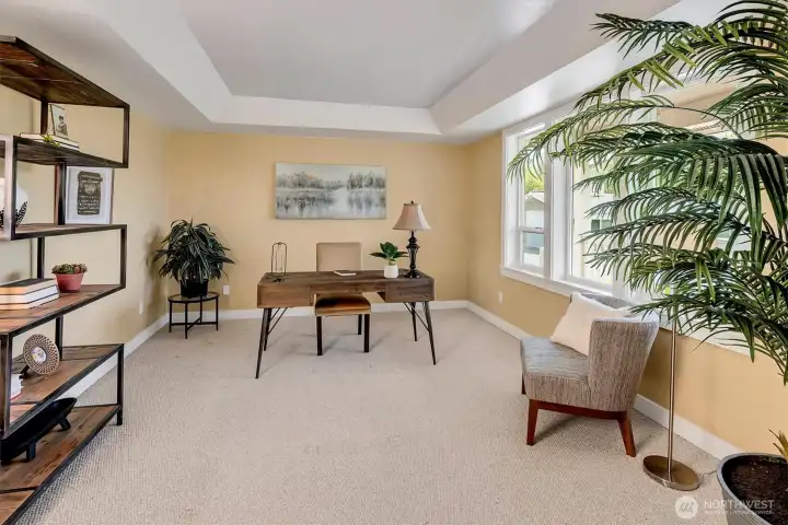 Front room staged as office but could also be formal living room.
