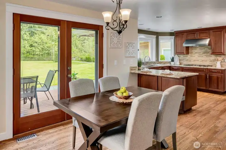 Informal dining opens to deck and backyard.