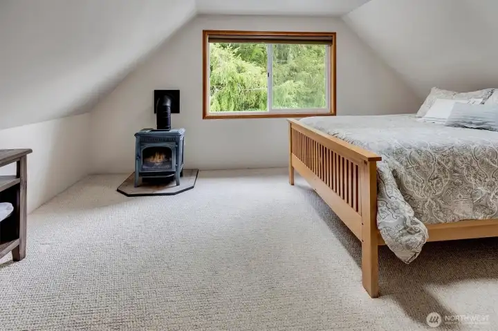 Guest quarter bedroom with propane fireplace.