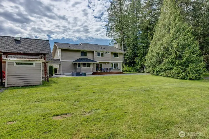 Backyard offers privacy and access to covered parking for equipment and shed.