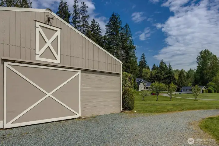 The barn is positioned on the property with plenty of room for trailer parking and easy pull-through driveway.
