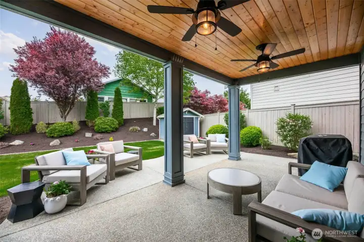 Dream yard with oversized patio, lush landscaping, mature trees, sprinker system and uplighting