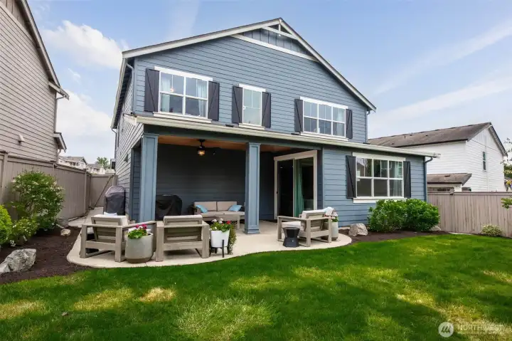Dream yard with oversized patio, lush landscaping, mature trees, sprinker system and uplighting