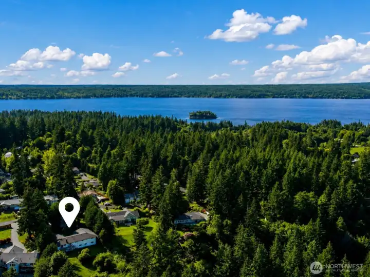 Experience the peaceful side of Gig Harbor living. Nestled on 1.25 private acres in the sought-after Kopachuck area, this beautifully updated home is surrounded by towering evergreens, established neighborhoods, and access to some of the South Sound's most treasured outdoor recreation. Enjoy proximity to Kopachuck State Park, scenic shoreline trails, kayaking, boating, and the natural beauty that defines Pacific Northwest living.