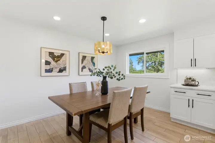 Dining space positioned to enjoy views of the surrounding landscape while remaining connected to the kitchen and living areas.
