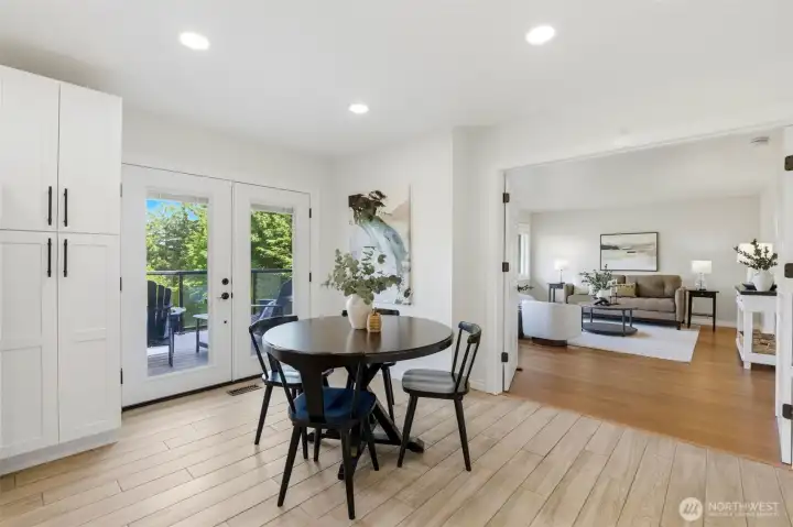 Conveniently located just off the remodeled kitchen, the breakfast area features double French doors that open to the brand-new Trex deck, ideal for entertaining, outdoor dining, and enjoying the private surroundings.