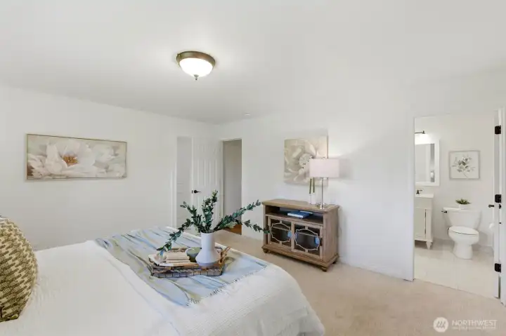 Spacious primary retreat featuring peaceful views, generous proportions, and a private ensuite bath.
