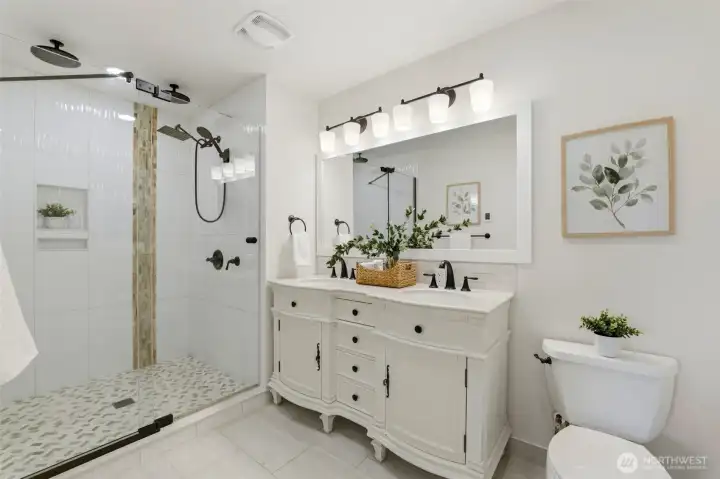 Private primary bathroom designed for comfort and everyday convenience. Thoughtful upgrades including heated bathroom floors add comfort and luxury.