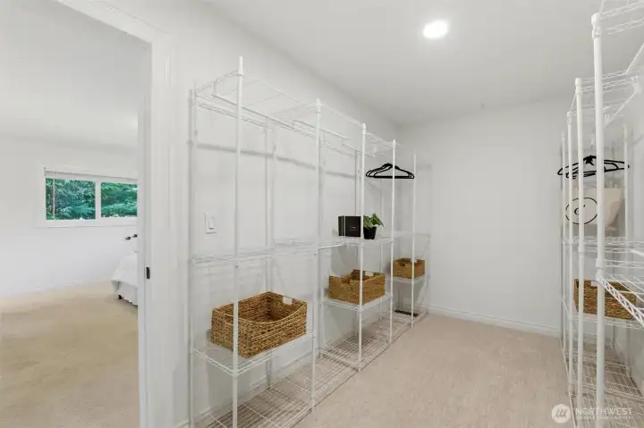 Large walk-in closet providing excellent storage and organization.