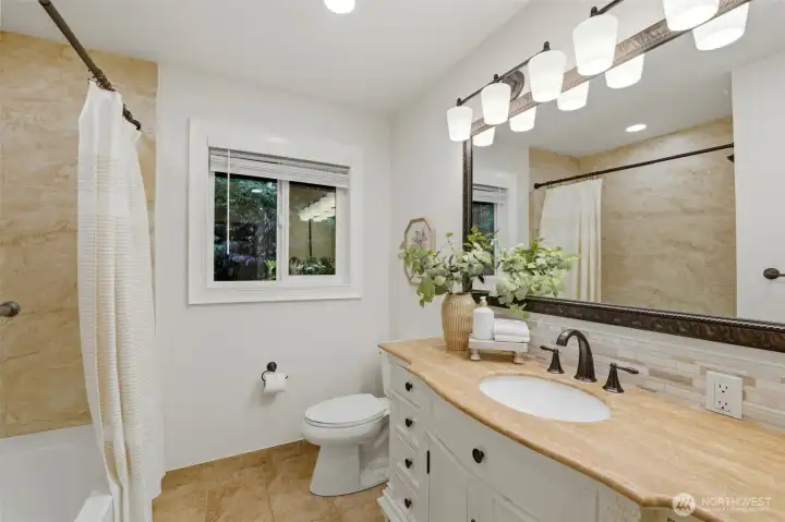 Updated full bath conveniently serving the upper level featuring 2 showers!