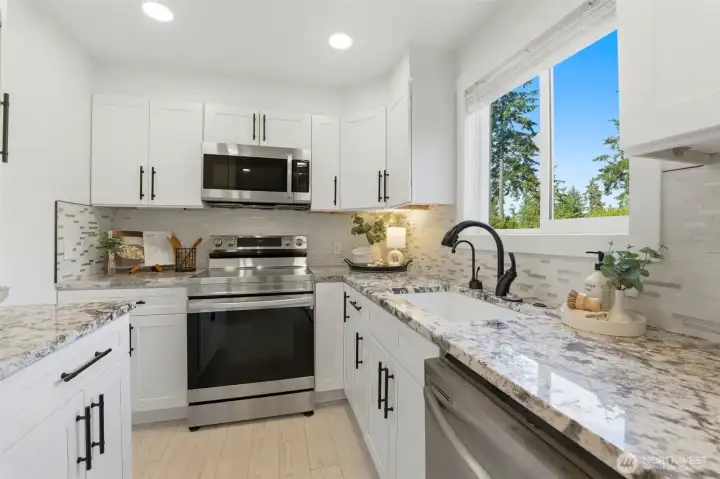 Lower-level kitchen creates opportunities for guests, multi-generational living, or potential rental flexibility.