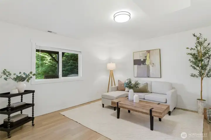 Versatile lower-level living area perfect for movie nights, recreation, game room activities, or extended living arrangements. OR turn it into a 6th bedroom.