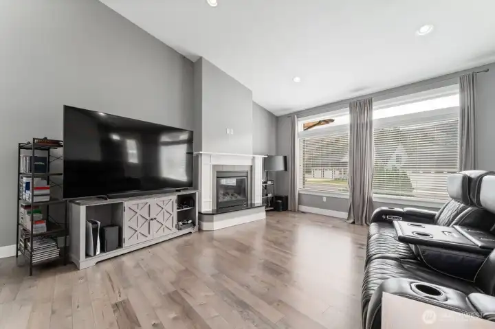 Living room featuring large windows and natural light. Living room featuring large windows and natural light.