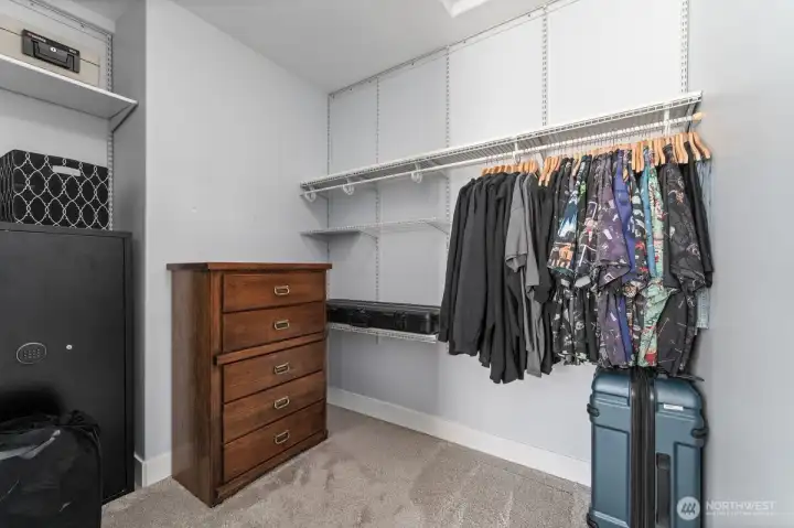 Primary walk-in closet with plenty of storage space. Primary walk-in closet with plenty of storage space.
