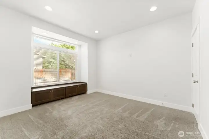 Large custom window seat with storage in bedroom 4. Large custom window seat with storage in bedroom 4.