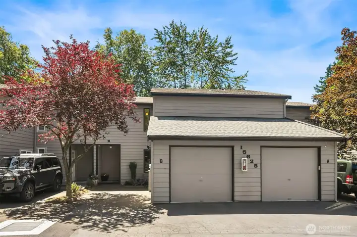 Situated in the rear-most building, Unit B has an attached one car garage and a dedicated parking space steps from the front door. (Guest parking is available nearby.) New roof May 2026. Situated in the rear-most building, Unit B has an attached one car garage and a dedicated parking space steps from the front door. (Guest parking is available nearby.) New roof May 2026.