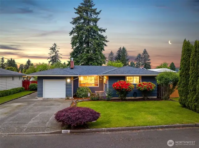 Beautifully maintained home featuring a brand new roof and mature landscaping.