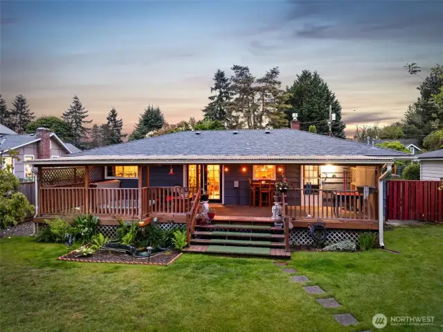 The back of the home features a spacious covered porch, ideal for entertaining guests or enjoying outdoor relaxation.