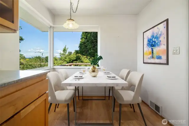 Kitchen eating space with view windows - Virtually staged to show potential.