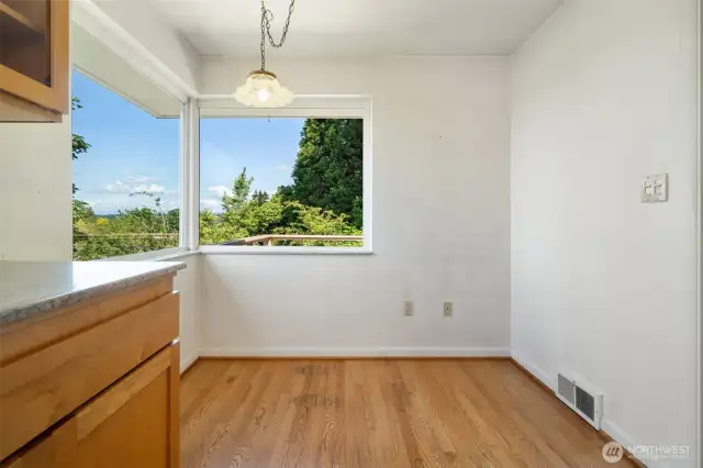 Kitchen eating space with views and hardwoods