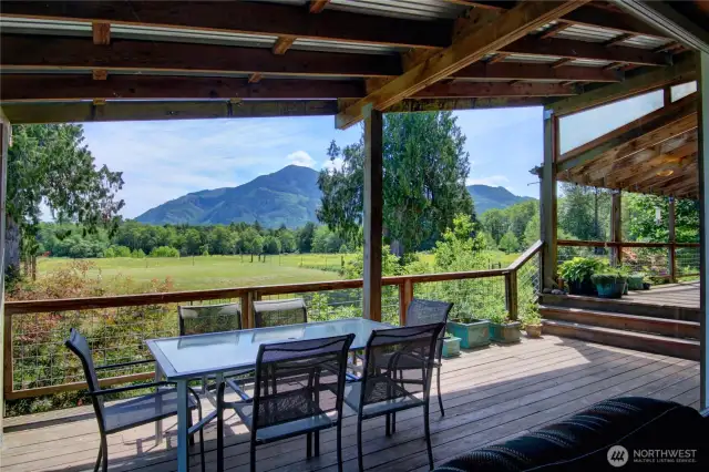 Deck access from great room off backside of lodge with pastoral & mountain views