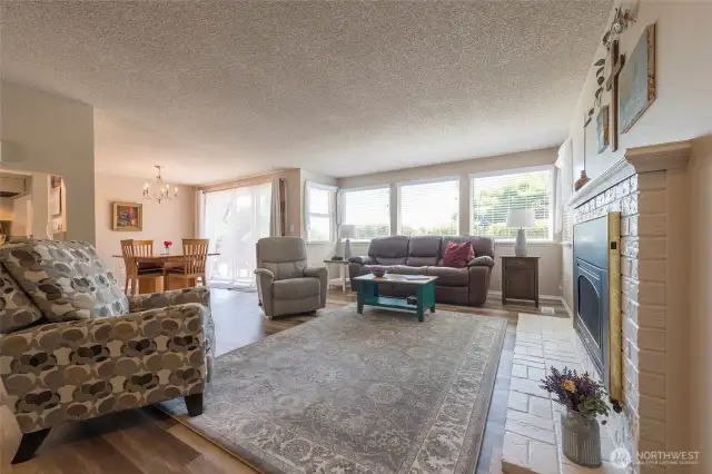 Light-filled living room with large picture windows.