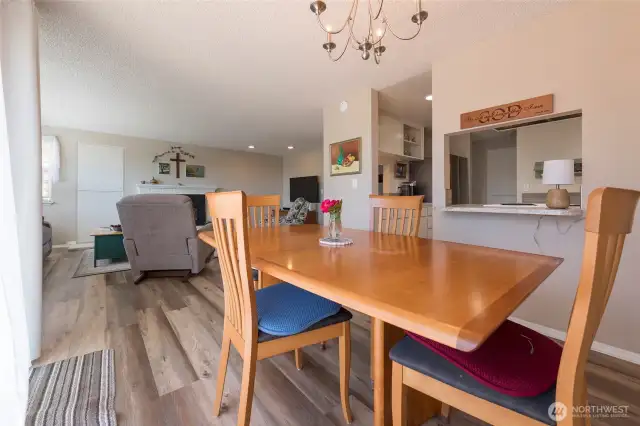 Open-concept dining flows effortlessly into the kitchen.