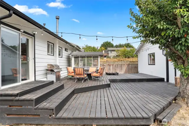 Back slider leads to large deck and access to door to 3-car garage.