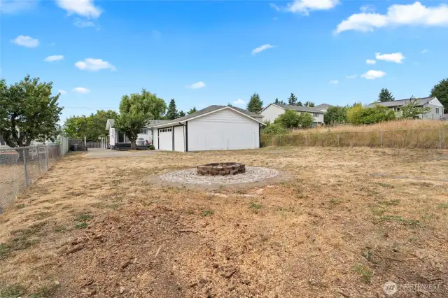 Large back yard with fire pit for those late night lounging.