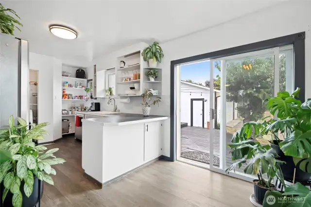 Kitchen nook area large enough for table and breakfast bar countertop in addition